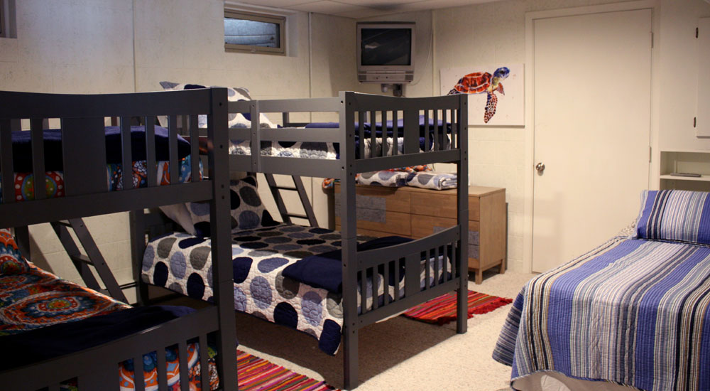 One of the downstairs bedrooms - two bunk beds with an additional full-sized bed