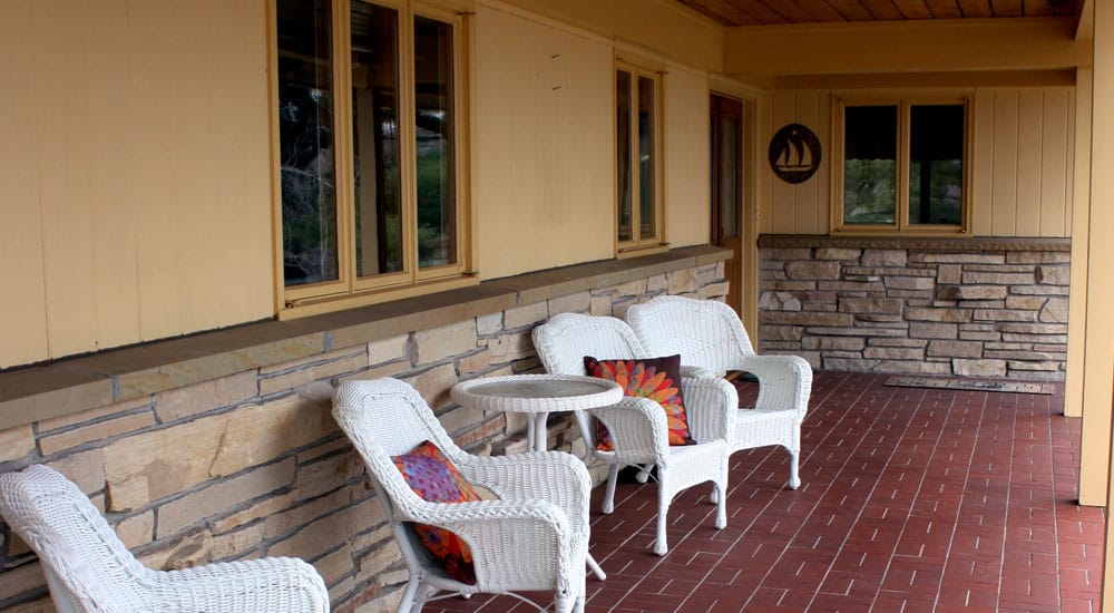 Relax on the back porch while listening to the sounds of nature